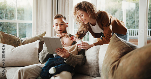 Canvas Print Happy, parents and toddler at house with tablet, social media and watching cartoon for bonding