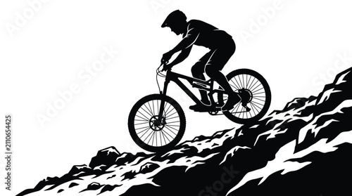 Mountain biker riding downhill. Extreme cyclist silhouette on a rocky mountain trail.
