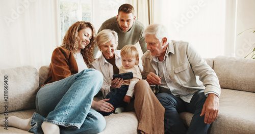 Cuadro en lienzo Smile, family and toddler at house with phone, baby pictures and watching cartoon for bonding