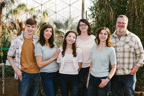 Принти на полотні Happy large family of six posing in a greenhouse