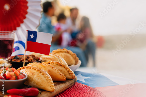 Chilean empanadas and pebre served for Fiestas Patrias celebration. Flag and food for Independence Day holiday.