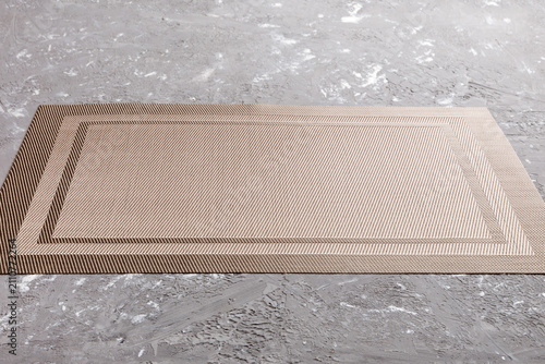 Perspective view of brown tablecloth for food on cement background. Empty space for your design