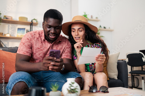 Obraz na plátně Couple planning trip and booking vacation tickets online