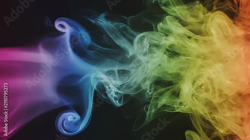 Colorful smoke swirling in vibrant rainbow hues on black background with smooth gradient flow