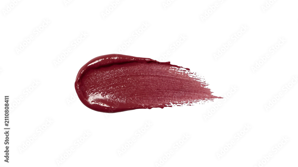 Fototapeta premium Thick swipe of deep plum lipstick swatch isolated on white background