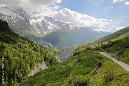 View from a hiking trail towards Valfroide Valley above La Grave village, Romanche Valley, Hautes Alpes (French Southern Alps), France, with the hamlet Les Hieres and La Meije mountain range (Ecrins N