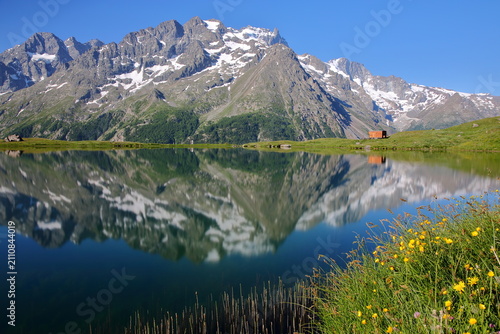 Reflections on the Pontet lake, Romanche Valley, Hautes Alpes (French Southern Alps), France,  with La Meije mountain range (Ecrins National Park)