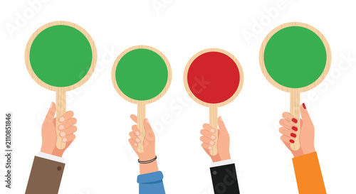 Fotografie Judging the Odds: Four hands hold up colorful paddles, two green, one red, and one green, illustrating a decision-making process or a poll