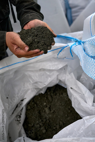 Hand Holding Soil Sample – Construction Material