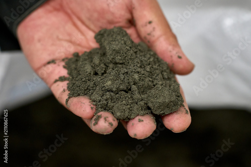 Close-up of Soil Sample in Hand - Construction Materials