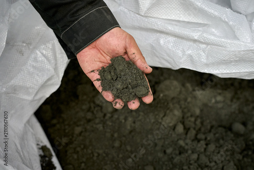 Hand Holding Soil Sample - Construction Agriculture