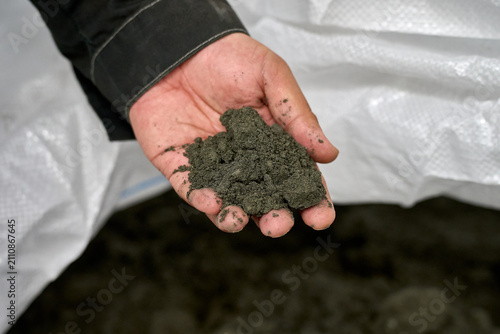Hand Holding Soil Sample - Agricultural Concept