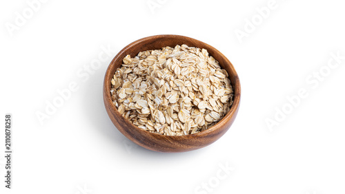 Oatmeal in a wooden bowl isolated on a white background. High quality photo