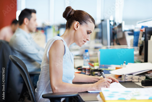 Obraz na plátně Business, woman or writing on paperwork in office for story ideas, source notes or draft editing