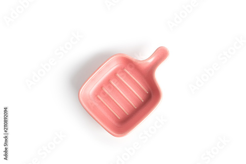 Pink gravy boat isolated on a white background. High quality photo