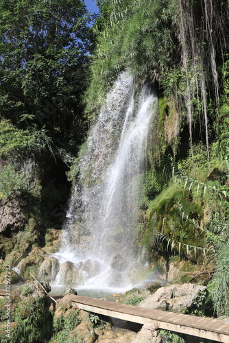 Фотография Gorgo de la Escalera waterfall with wooden footbridge and rainbow in Anna, Valen