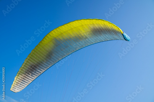 Paragliding in blue sky