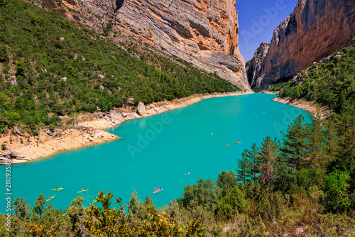 Spectacular view of the Congost de Mont-rebei, gorge carved by the Noguera Ribagorçana River in the Montsec mountain range, Catalonia, Spain. The famous cliffside hiking trail.