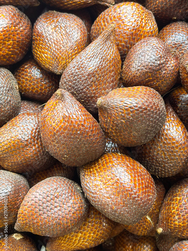 Slika na platnu Pile of Salak fruit (Salacca zalacca) in the supermarket, a fruit with a distinctive sweet taste and slightly astringent but crunchy