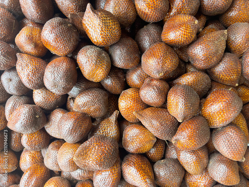 Bild auf Leinwand Pile of Salak fruit (Salacca zalacca) in the supermarket, a fruit with a distinctive sweet taste and slightly astringent but crunchy