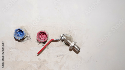 pex pipe outlets and water tap fitting on wall