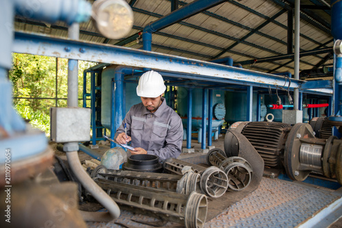 Принти на полотні Industrial Technician Examining Pump Impeller for Preventive Maintenance in Wate