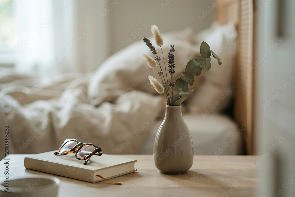 Fototapeta premium Vase with dried flowers and lego bird on a wooden table illustration