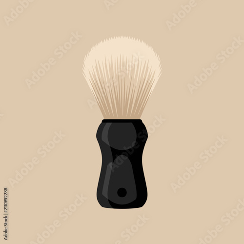A professional shaving brush with a black handle on beige background
