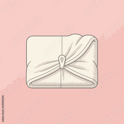 A neatly folded white cloth tied with a simple fabric knot