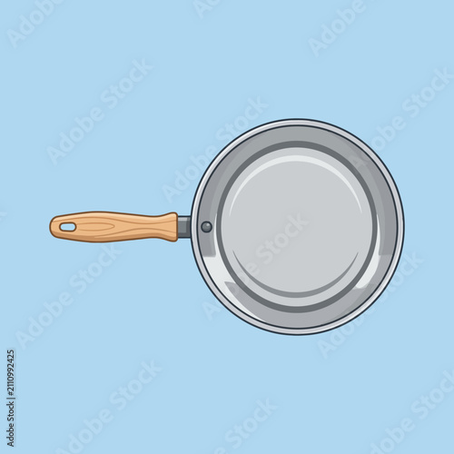 A top view of a metal frying pan with wooden handle