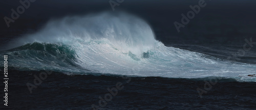 Powerful Breaking Ocean Wave with Dramatic Sea Spray in Stormy Sea