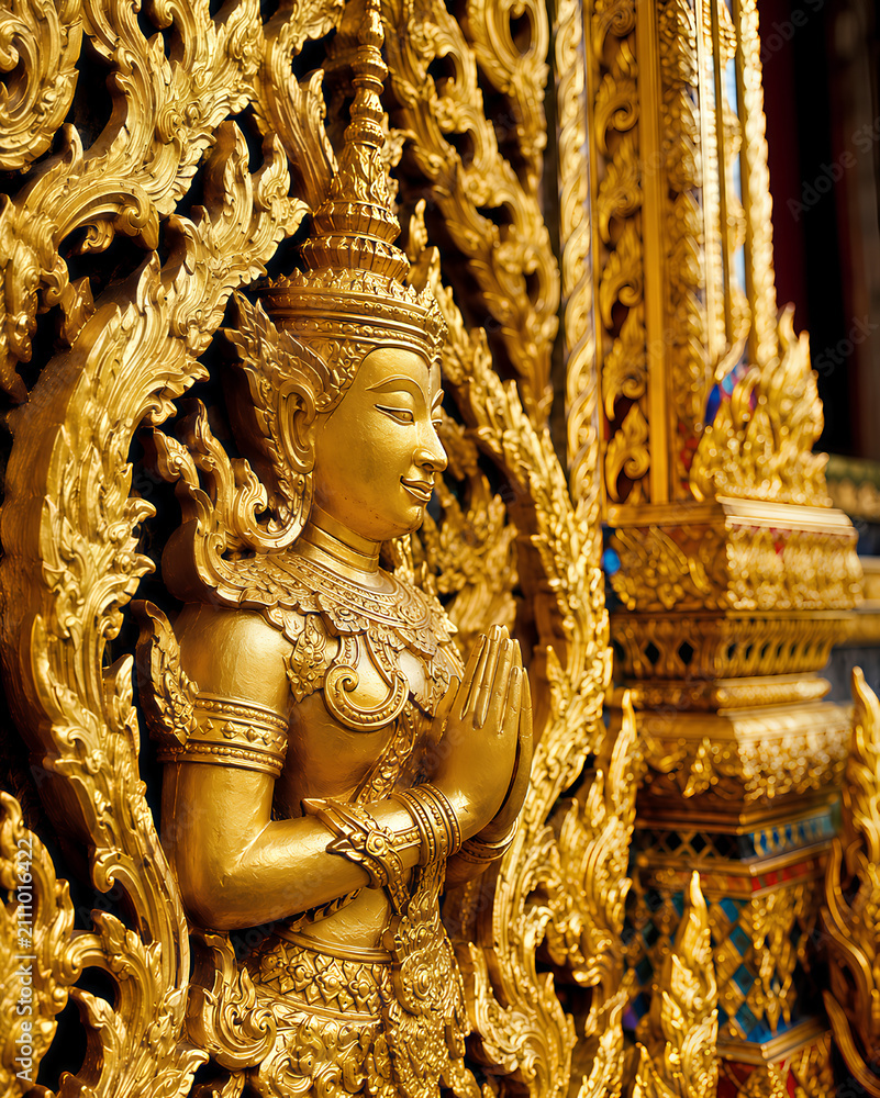 Fototapeta premium Golden Thai Angel Deva Sculpture in Praying Gesture
