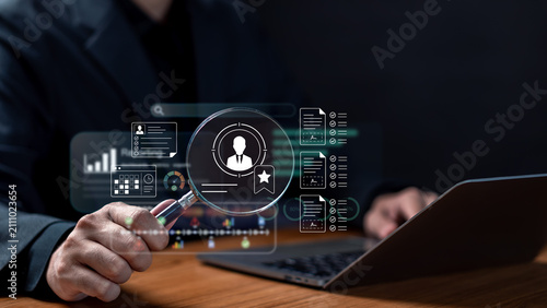 Headhunting talent search and employee performance evaluation concept. HR manager holding magnifying glass over virtual candidate profile with resume checklists and rating dashboard.