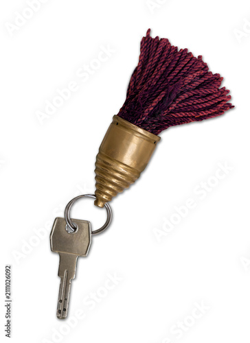 Bild auf Leinwand Old hotel key with decorative tassel key fob on elegant vintage background