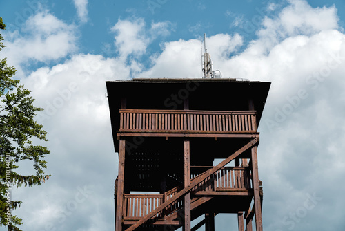 View of the observation tower on Dzikowiec Mountain from the upper station of the chairlift in Boguszów-Gorce, Poland.