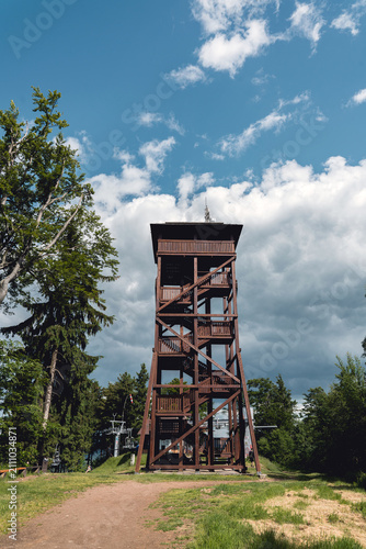 View of the observation tower on Dzikowiec Mountain from the upper station of the chairlift in Boguszów-Gorce, Poland.