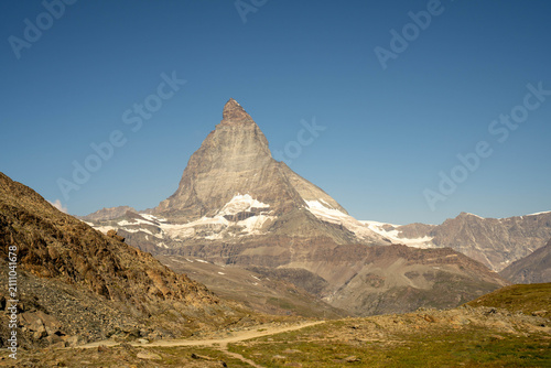 Majestic Matterhorn peak reflection in Riffelsee lake near Gornergrat, Zermatt, Swiss Alps in summer