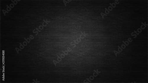 Black Fabric Canvas Texture Background with Center Spotlight Effect

