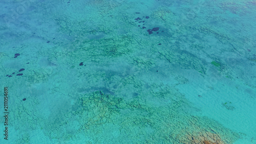Cuadro en lienzo Bird eye aerial view of clear turquoise sea water surface with underwater reef f