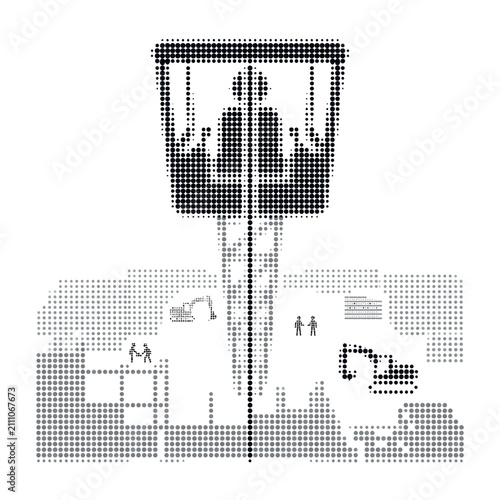 Construction worker operating a crane in a busy construction site.