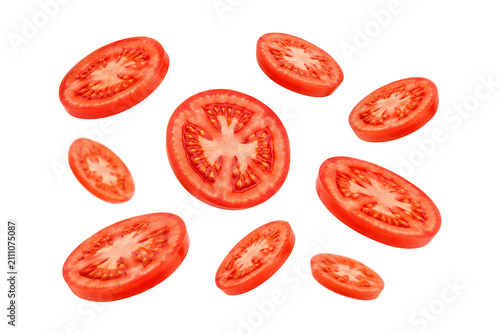 Bild auf Leinwand Floating fresh tomato slices isolated on a pure white background, arranged in a clean dynamic composition with vibrant natural color, juicy flesh, visible seed chambers, and crisp cutout edges