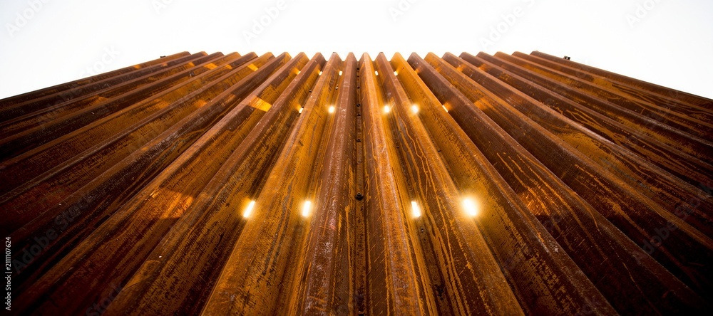 Obraz premium Rusted Corrugated Metal Sheets Industrial Burnt Orange Texture