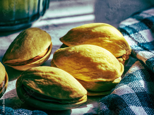 Close‑Up of Nuts on Light Surface with Checkered Cloth