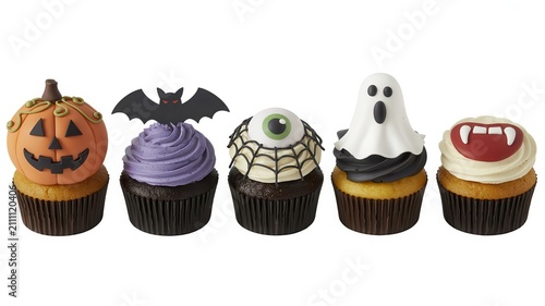 Set of Halloween cupcakes isolated on white background. Festive party food.
