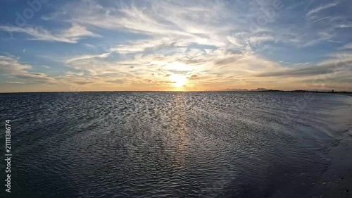 Golden Hour Sunset over Calm Water at Arubinha Lagoon in Arraial do Cabo, Brazil