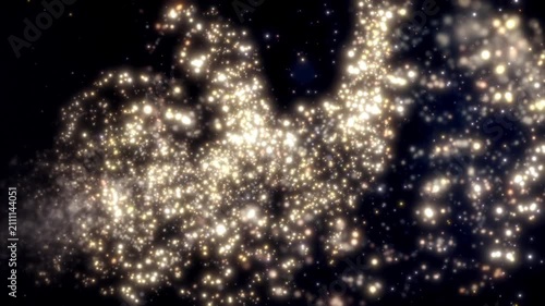 This stock motion graphic shows a spiral of golden light particles.