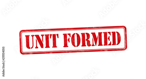 A bold red stamp with a white border and black text that reads unit formed, conveying a sense of official formation or completion in a striking and authoritative design