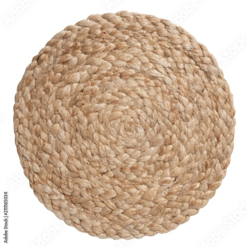 Round braided natural jute placemat or rug with chunky woven spiral texture on white background.