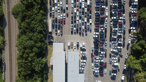 Parallel metal warehouse roofs extend over commercial storage facilities following established local architectural patterns. Distribution structures anchor industrial operations in Irving, TX