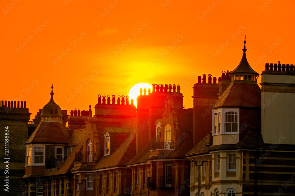 Fototapeta premium Orange Sunset Behind Historic Brighton Rooftops